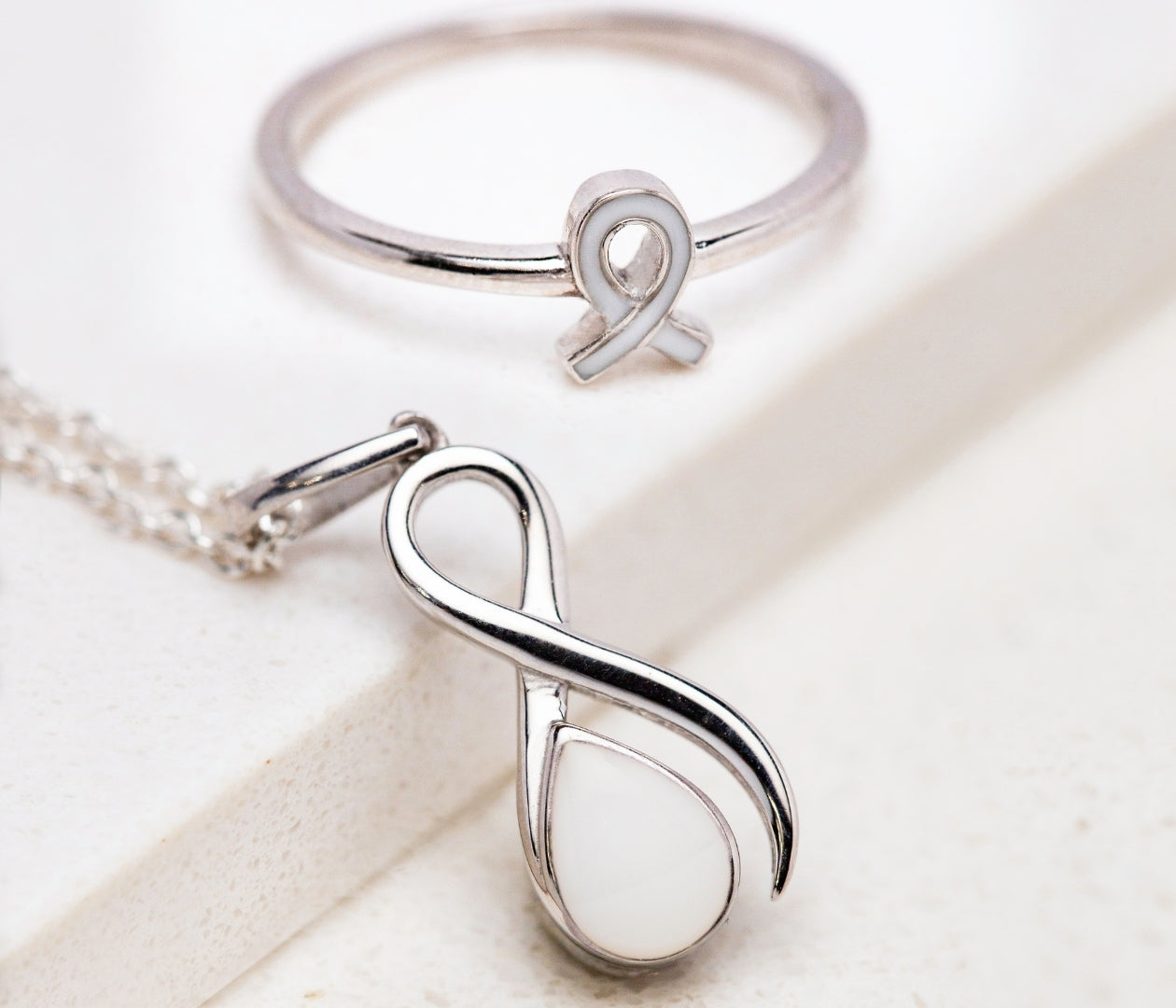Breast Cancer Warrior Collection pendant and ring in sterling silver with white breastmilk stones