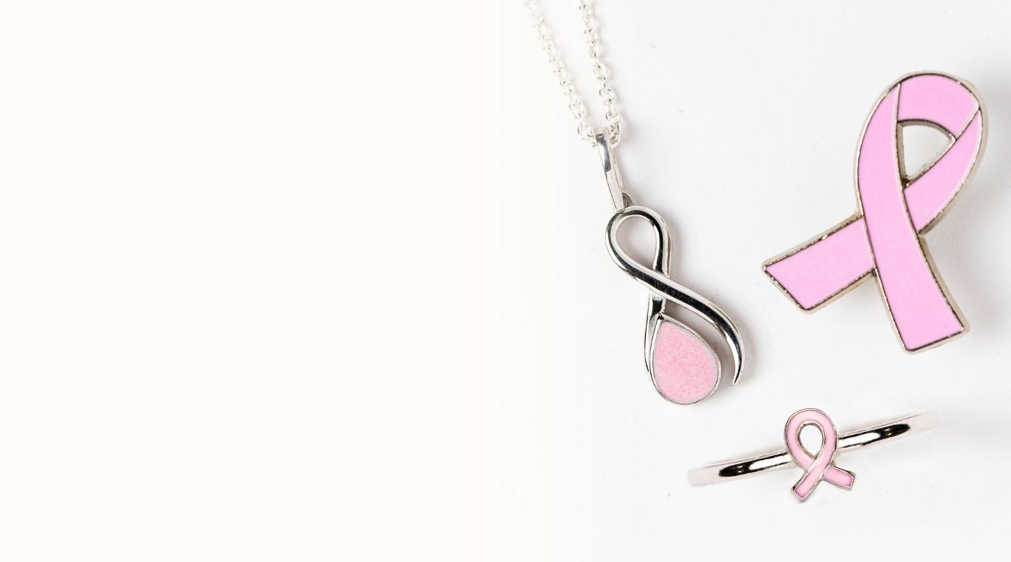 Breast Cancer Warrior Collection pendant and ring with pink awareness ribbon and exclusive pink stone inclusions — handcrafted breastmilk jewelry by Mamma’s Liquid Love