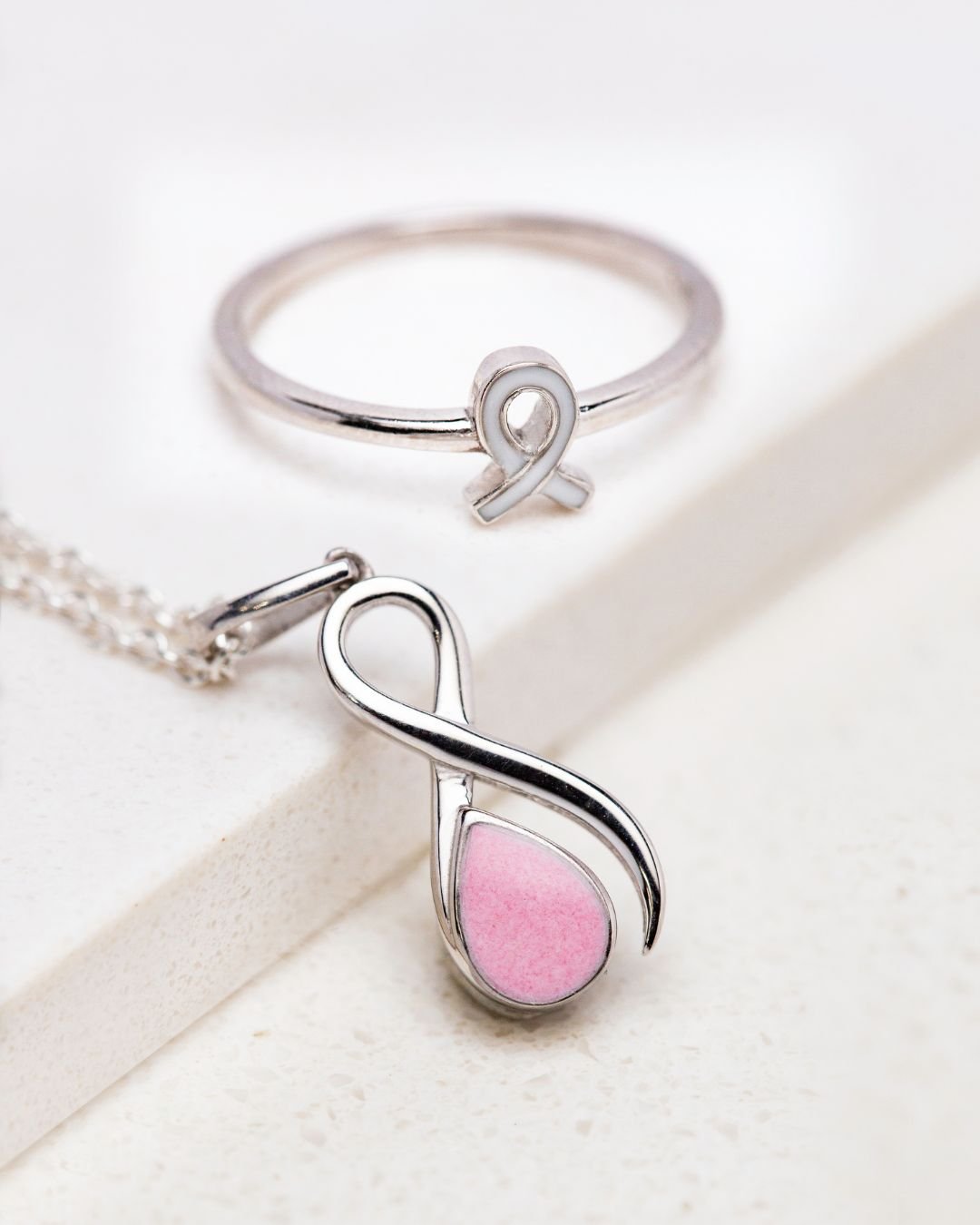 Ribbon of Hope breastmilk jewelry set — awareness ribbon ring and teardrop keepsake pendant with pink shimmer inclusion for breast cancer awareness