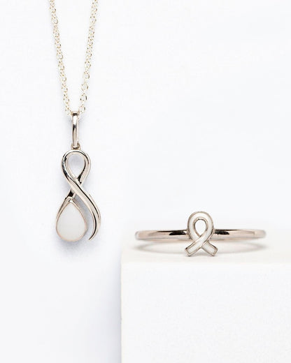 Breastmilk keepsake ribbon ring and pendant set in sterling silver for breast cancer awareness