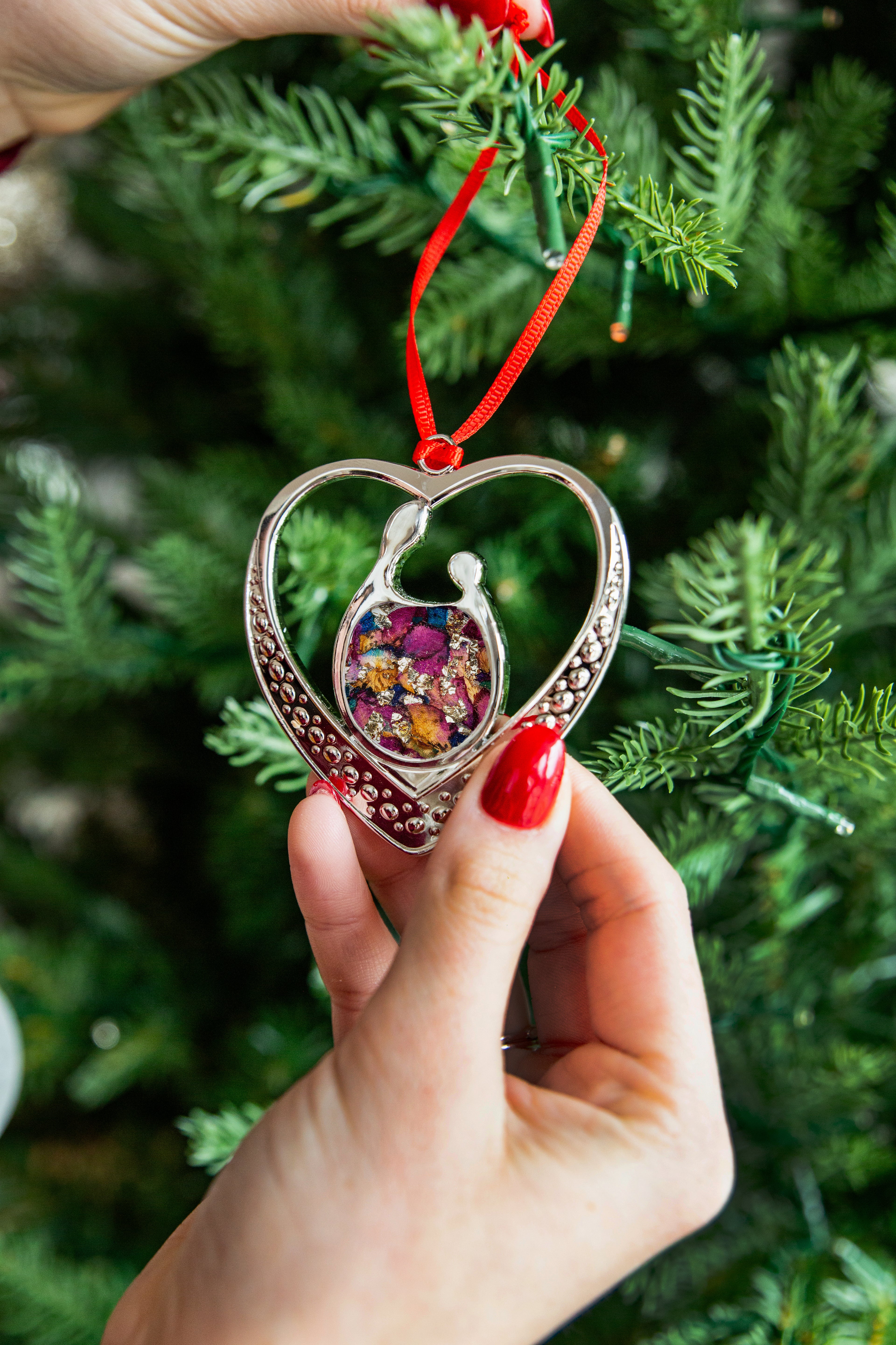 Gold Unbreakable Bond Ornament with heart filled with gold flakes and dried florals
